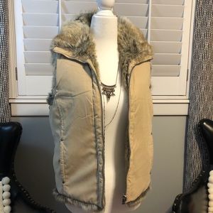 Reversible Pale yellow suede/fur vest.